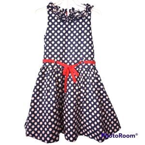 Savannah girls polka dot dress with tulle underneath and bow detailing